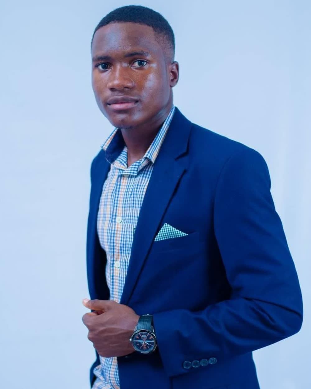 Brian Chikada, founder and managing director of LaGraphico Zimbabwe, in a navy suit jacket